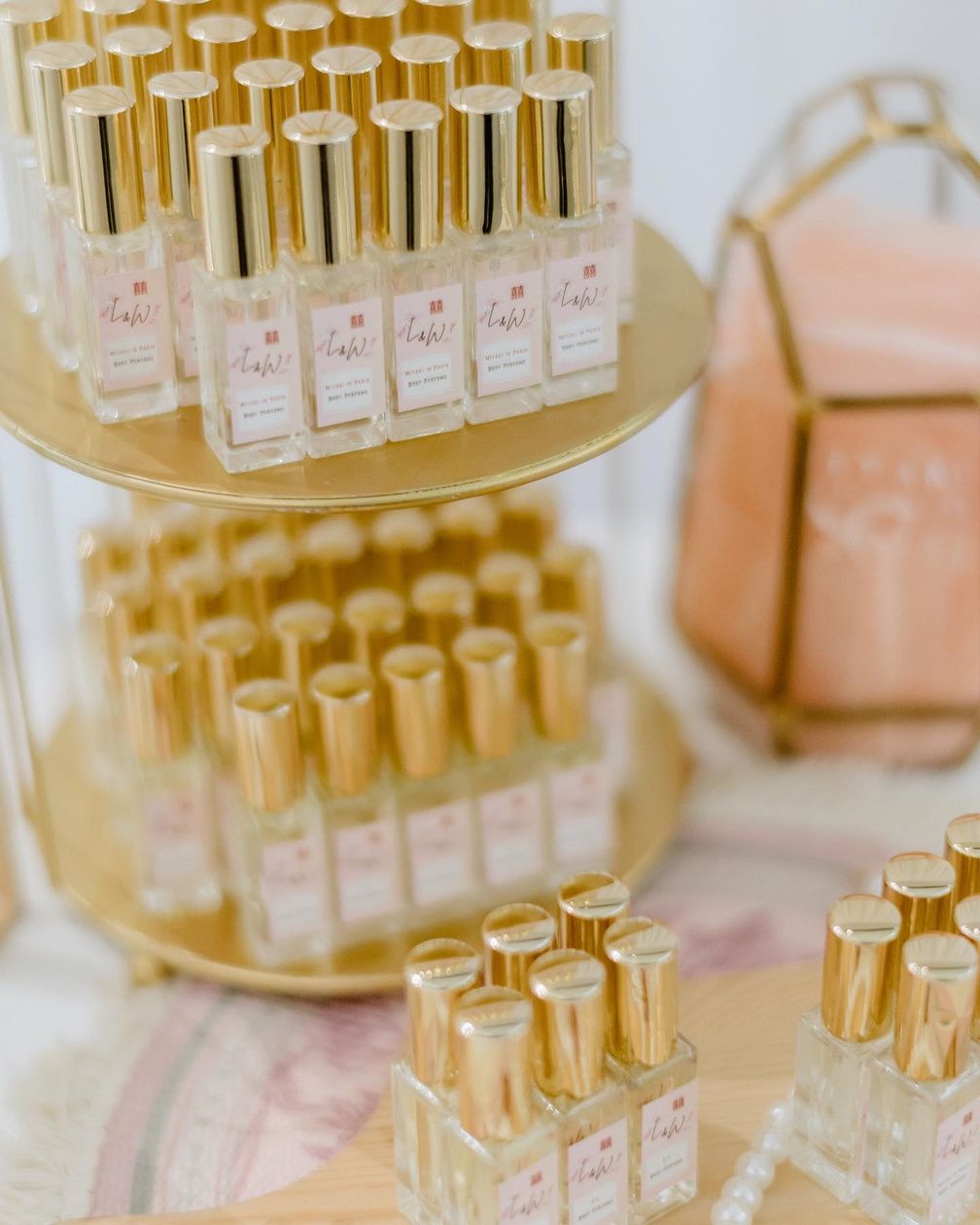 Gold-capped personalised perfume bottles