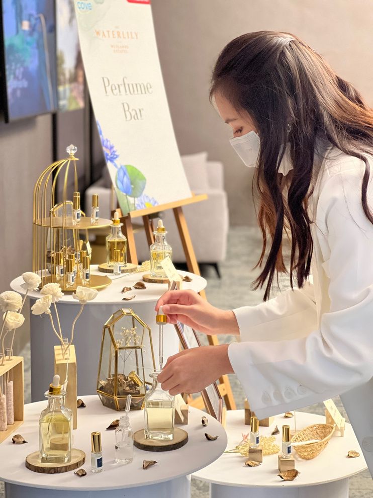 Perfumer blending a scent at the bar