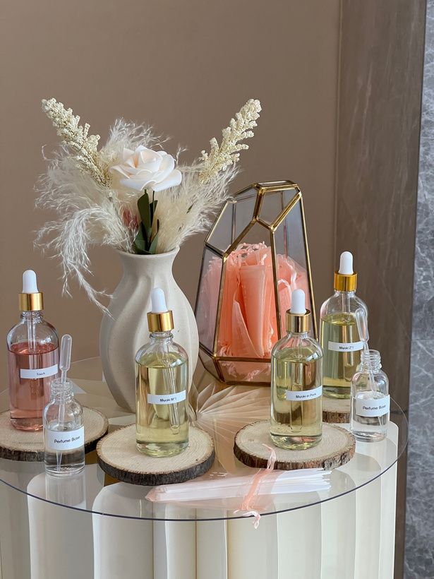 Perfume bottles with pampas and roses