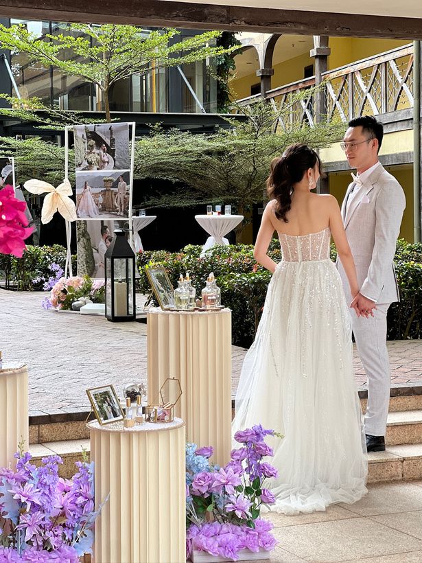 Guest smelling a perfume at an event